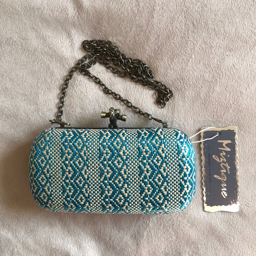 Miztique teal & cream woven hard shell clutch